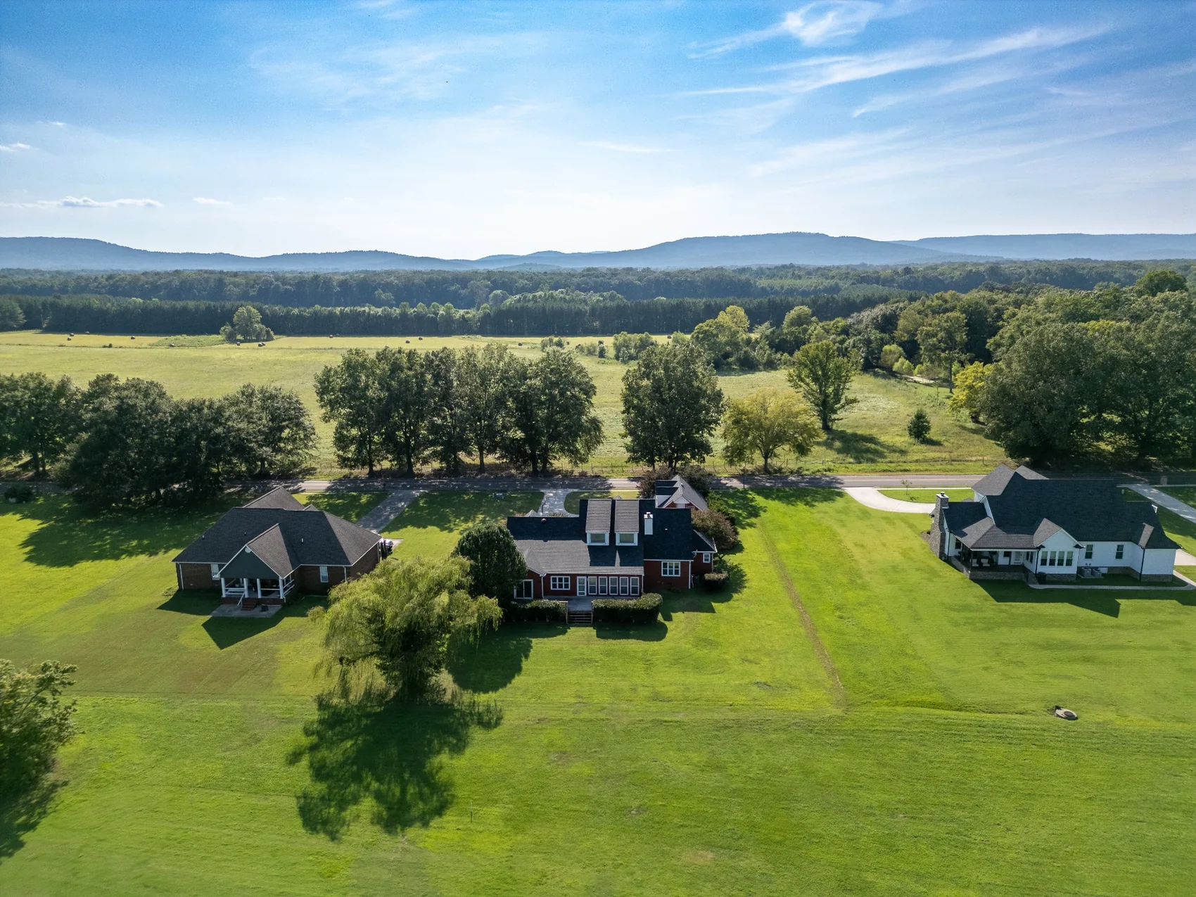 Aerial view of country homes and green fields in North Alabama