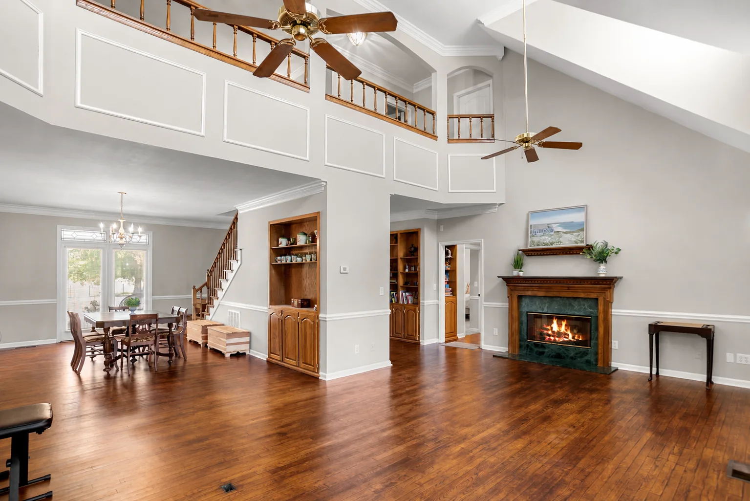 Large open living room with fireplace and double-height ceiling