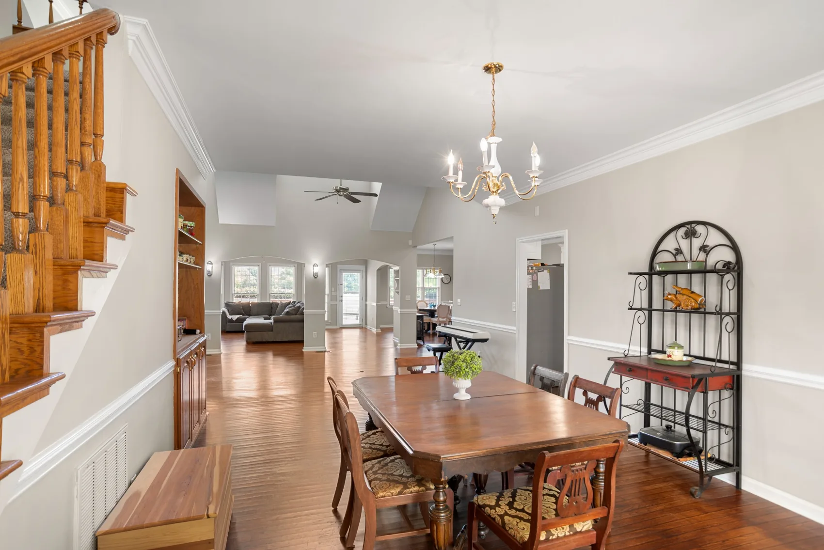 Open dining area with wood flooring and a view toward the living room